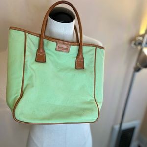 Hartmann small tote in pistachio green with tan leather trim, snap closure